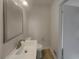 This charming bathroom features a toilet, floating sink, and updated vanity at 2217 Troutdale Dr, Decatur, GA 30032