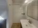 Well-lit bathroom featuring a tiled shower, updated vanity, and neutral color palette at 2217 Troutdale Dr, Decatur, GA 30032