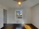 Cozy bedroom featuring hardwood floors, a window with natural light, and a closet, providing a comfortable retreat at 2217 Troutdale Dr, Decatur, GA 30032