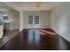 This living room has French doors leading to a porch, hardwood floors, and natural light, flowing into the kitchen at 2217 Troutdale Dr, Decatur, GA 30032