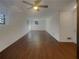 Spacious living room with fresh paint, hardwood floors, ceiling fans, and windows bringing in natural light at 2217 Troutdale Dr, Decatur, GA 30032
