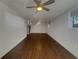 Spacious room with hardwood floors, fresh paint, and a staircase, offering a bright and open living area at 2217 Troutdale Dr, Decatur, GA 30032