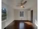 Clean bedroom with dark wood floors, a ceiling fan, and lots of natural light at 2217 Troutdale Dr, Decatur, GA 30032