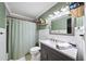 Modern bathroom with custom vanity, updated fixtures, and decorative mirror at 4101 Morgan Rd, Tucker, GA 30084