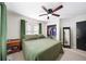 Cozy bedroom featuring a ceiling fan, closet, and warm, natural light at 4101 Morgan Rd, Tucker, GA 30084
