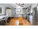 Light-filled kitchen with stainless steel appliances, light gray cabinets, and adjacent laundry at 4101 Morgan Rd, Tucker, GA 30084