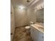 Bathroom featuring tile floors, a toilet, and a vanity with sink at 731 Hanover Se Ln, Marietta, GA 30067