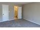 Bedroom has carpeted floors and neutral-toned walls, leading to bathroom at 731 Hanover Se Ln, Marietta, GA 30067