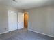 A neutral-toned bedroom with a double closet offers ample storage at 731 Hanover Se Ln, Marietta, GA 30067