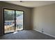 Bedroom featuring carpeted floors and large sliding glass doors to the exterior at 731 Hanover Se Ln, Marietta, GA 30067