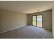 A well-lit room with carpeted floors and large sliding glass doors at 731 Hanover Se Ln, Marietta, GA 30067