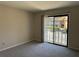 This bedroom boasts a sliding glass door to a balcony overlooking the community at 731 Hanover Se Ln, Marietta, GA 30067