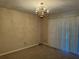 Dining room featuring neutral colored carpet and gold chandelier at 731 Hanover Se Ln, Marietta, GA 30067