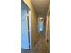 Neutral hallway with carpet, leading to various rooms in the home at 731 Hanover Se Ln, Marietta, GA 30067