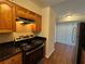 Kitchen featuring stainless steel appliances, range hood, and tile floor at 731 Hanover Se Ln, Marietta, GA 30067