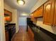 Well-equipped galley kitchen with stainless steel appliances, tile floors, and ample cabinet space at 731 Hanover Se Ln, Marietta, GA 30067
