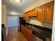 Well-lit kitchen featuring stainless steel appliances and sleek black countertops at 731 Hanover Se Ln, Marietta, GA 30067