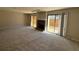 Spacious living room featuring a fireplace and sliding glass door at 731 Hanover Se Ln, Marietta, GA 30067