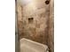 This shower has a built-in niche, designer tile, and modern fixtures at 731 Hanover Se Ln, Marietta, GA 30067