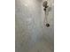 A full view of the stand-up shower features a marbled tile and modern shower head at 731 Hanover Se Ln, Marietta, GA 30067