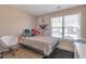 Relaxing bedroom with natural light and a cozy seating area at 1025 Grace Dr, Lawrenceville, GA 30043