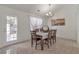 Cozy dining area with large windows, table for six, and stylish decor at 1025 Grace Dr, Lawrenceville, GA 30043