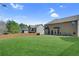 Lush backyard featuring manicured lawn and a wooden privacy fence at 1765 Stone Meadow Rd, Lithonia, GA 30058