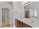 Bathroom with double sink vanity, large mirror, and shower with glass door at 1765 Stone Meadow Rd, Lithonia, GA 30058