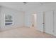 Bright bedroom featuring neutral carpet, a window, closet and ensuite access at 1765 Stone Meadow Rd, Lithonia, GA 30058