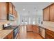 Lovely kitchen featuring wooden floors, stainless steel appliances, granite counters and a spacious breakfast bar at 1765 Stone Meadow Rd, Lithonia, GA 30058