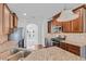 Beautiful kitchen with granite countertops, stainless steel appliances and dark wood cabinets at 1765 Stone Meadow Rd, Lithonia, GA 30058