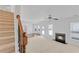 Spacious living room with a cozy fireplace and natural light from large windows at 1765 Stone Meadow Rd, Lithonia, GA 30058