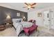 Cozy bedroom boasts ceiling fan, neutral color scheme, and natural light at 2755 Turning Leaf Dr, Lawrenceville, GA 30044