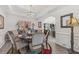 Traditional dining room with ample lighting and a view into the adjoining office space at 2755 Turning Leaf Dr, Lawrenceville, GA 30044