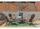 Backyard fire pit with chairs and decorative rock wall, perfect for outdoor gatherings at 2755 Turning Leaf Dr, Lawrenceville, GA 30044