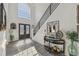 Bright foyer with high ceilings, large arched window, and decorative furnishings at 2755 Turning Leaf Dr, Lawrenceville, GA 30044