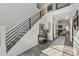 Welcoming foyer with a modern staircase, a view into the living room, and sleek flooring at 2755 Turning Leaf Dr, Lawrenceville, GA 30044