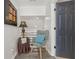 Charming hallway seating area with decorative chair, table, and accent artwork at 2755 Turning Leaf Dr, Lawrenceville, GA 30044