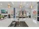 Kitchen island view featuring the sink, lighting, and an adjacent eating nook at 2755 Turning Leaf Dr, Lawrenceville, GA 30044