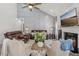 Inviting living room featuring a vaulted ceiling, fireplace, and comfortable leather seating arrangement at 2755 Turning Leaf Dr, Lawrenceville, GA 30044