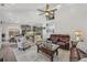 Bright, open living space featuring hardwood floors and an expansive view into the kitchen at 2755 Turning Leaf Dr, Lawrenceville, GA 30044