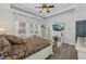 Bedroom with a large windows, tray ceiling, neutral tones, and ceiling fan at 2755 Turning Leaf Dr, Lawrenceville, GA 30044