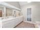 This main bathroom features double sinks, a large mirror, and a marble countertop at 5930 N Eton Ct, Duluth, GA 30097