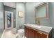 Basement powder room featuring modern vanity and large mirror at 5930 N Eton Ct, Duluth, GA 30097