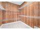 Walk-in closet with custom wood paneling and plenty of shelving for storage at 5930 N Eton Ct, Duluth, GA 30097