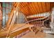 Unfinished attic space with wood beams, ductwork, and partial subfloor at 1545 Heritage Trl, Roswell, GA 30075