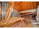 Unfinished attic space with wooden beams, insulation, and visible ductwork at 1545 Heritage Trl, Roswell, GA 30075