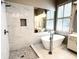 Spa bathroom featuring soaking tub, shower with glass and tile surround at 1545 Heritage Trl, Roswell, GA 30075