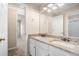 Bright bathroom with granite double sink vanity, neutral walls and trim with a glimpse of the shower at 1545 Heritage Trl, Roswell, GA 30075