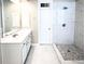 Bathroom with tiled shower and a single sink vanity at 1545 Heritage Trl, Roswell, GA 30075